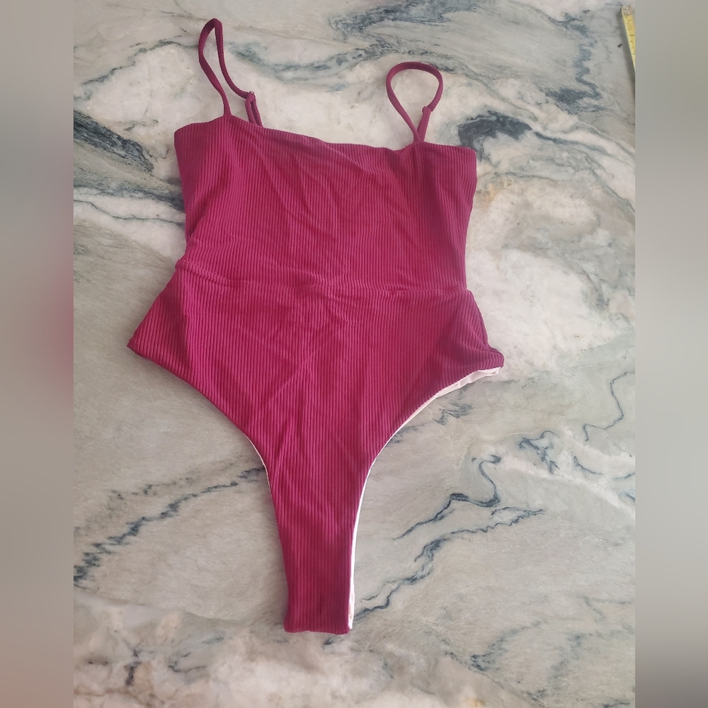 Cheeky one piece bathing suit.